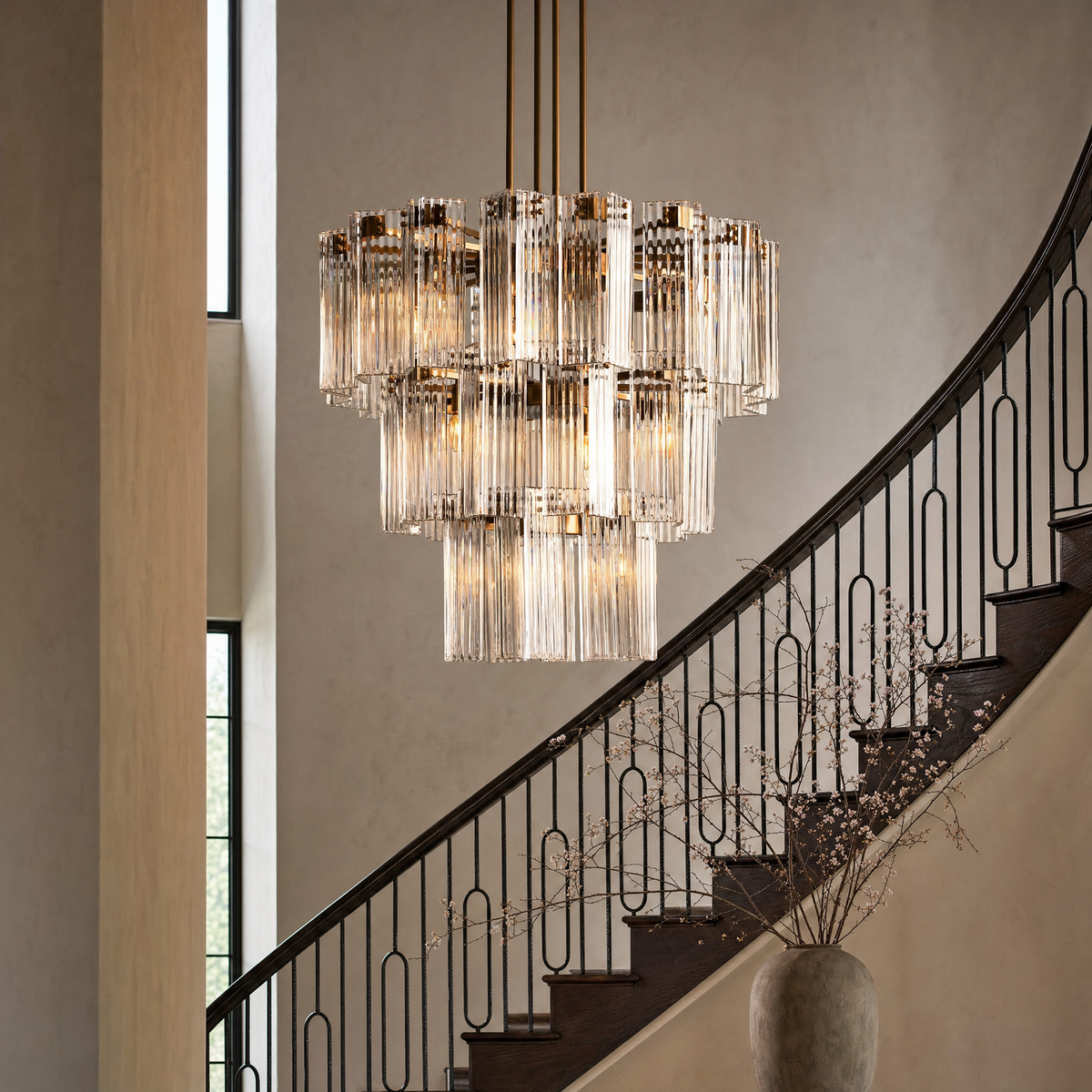 Delsie reeded-glass chandelier in a double-height stairwell